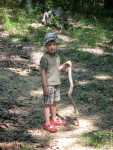 It was off to the cabin again this summer.  Do I look like a woodsman?  This is my Daddy's stick...but it broke (uh, by *complete* accident, I'm sure), so now it's just the right size for me.  Isn't that convenient?