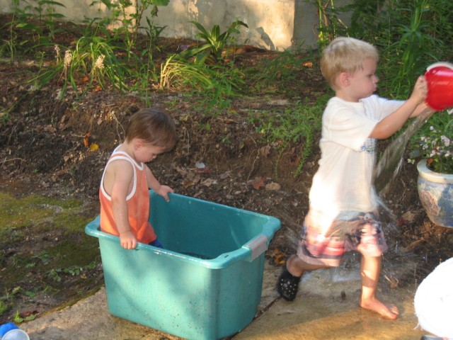 After the blueberry adventures, my friend Wuke (Luke) and I started playing in a tub of fetid water.  I'm sure there were an awful lot of waterborne diseases, but hey, what's being a kid without a little hepatitus scare?