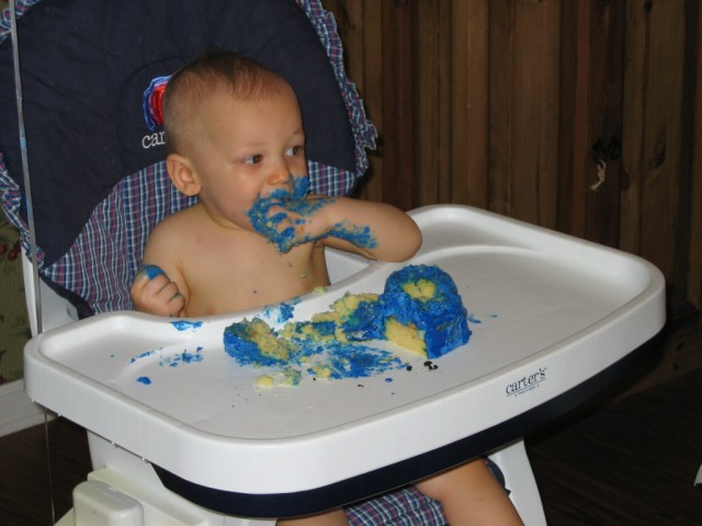 This is the obligatory "First Birthday With A Face Full Of Cake" picture.