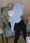 This is great grandma Gen holding a bundle of blankets that she purports to be Mason.